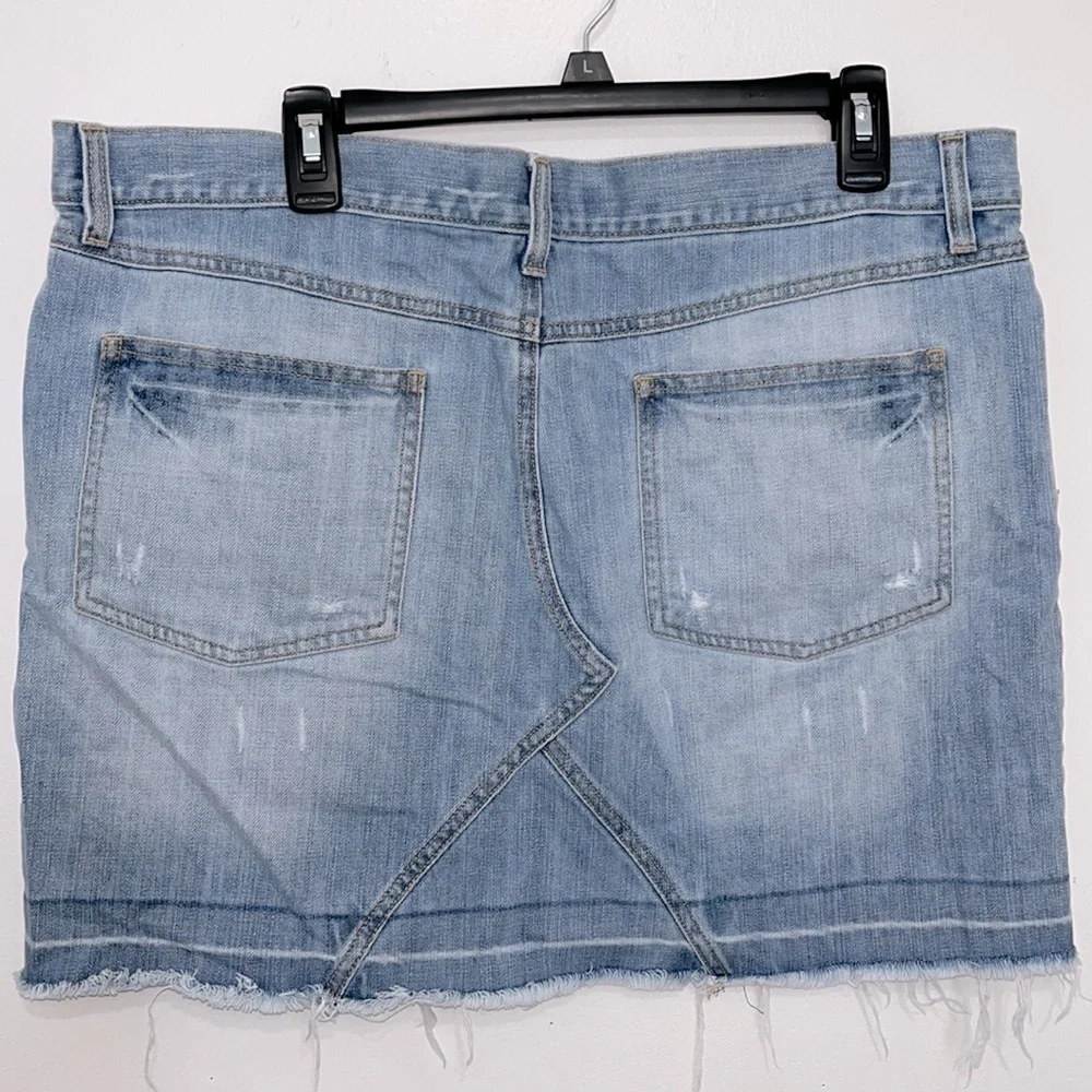 Old Navy’s Jeans ultra low waist stonewashed boho distressed frayed mini skirt.